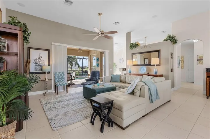 Living room featuring ceiling fan and light tile patterned flooring