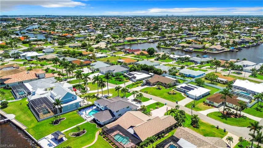 Aerial view with a water view and a residential view