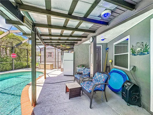 View of patio / terrace featuring a lanai and an outdoor pool