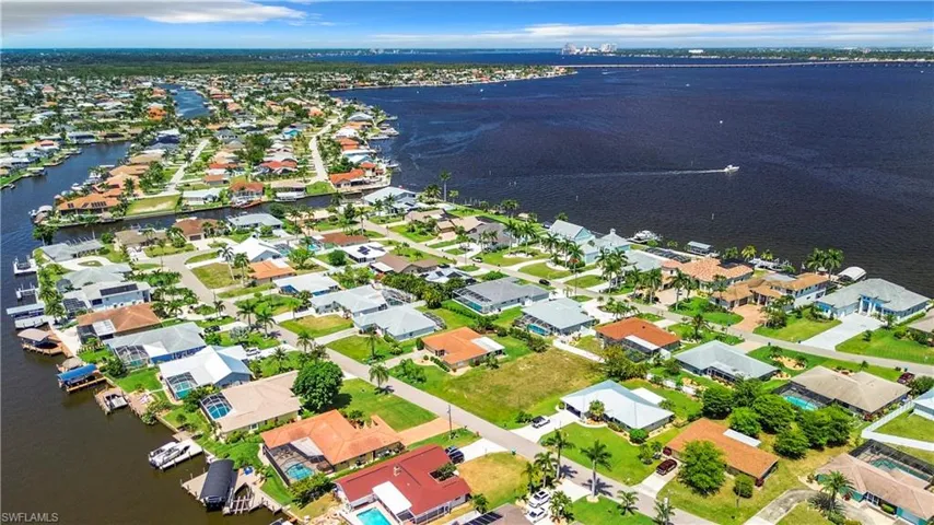 Drone / aerial view with a water view and a residential view