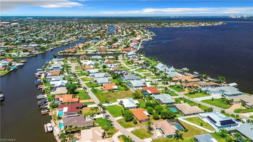 Drone / aerial view featuring a water view and a residential view