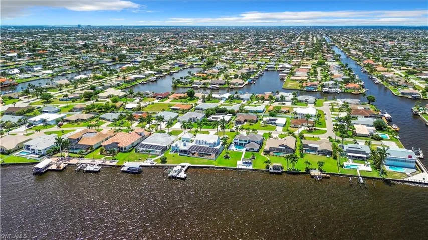 Aerial view with a water view and a residential view