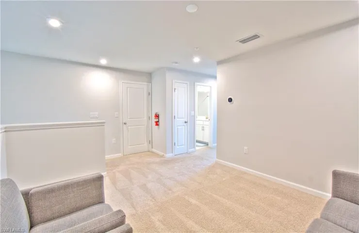 Unfurnished room featuring light colored carpet and recessed lighting