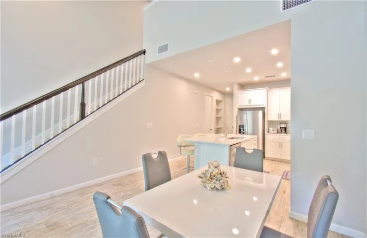Dining area featuring light wood-style flooring and recessed lighting