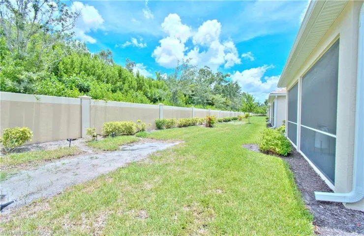View of yard with a sunroom