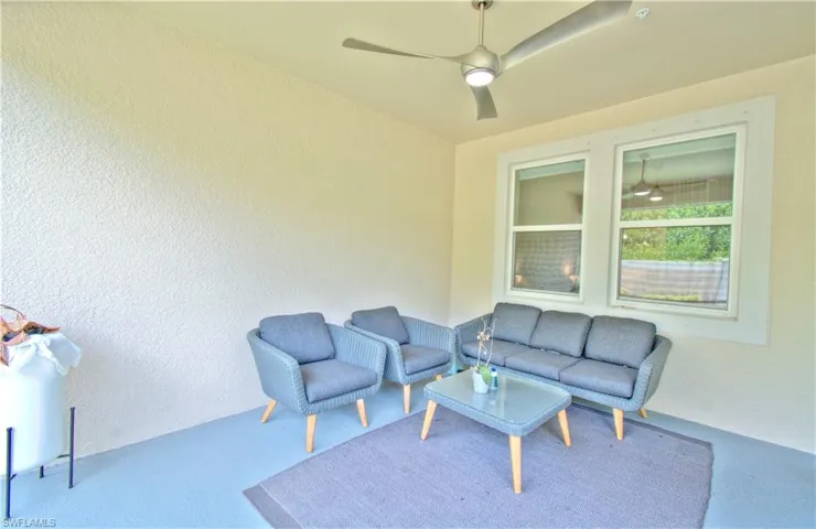 View of patio / terrace with outdoor seating and a ceiling fan