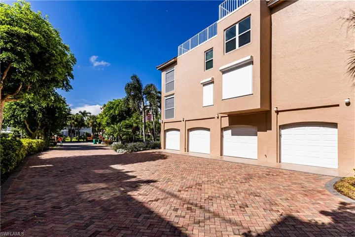 View of property exterior with a garage