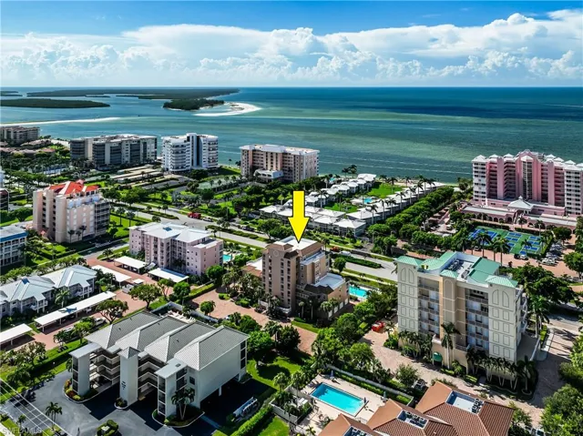 Birds eye view of property featuring a water view