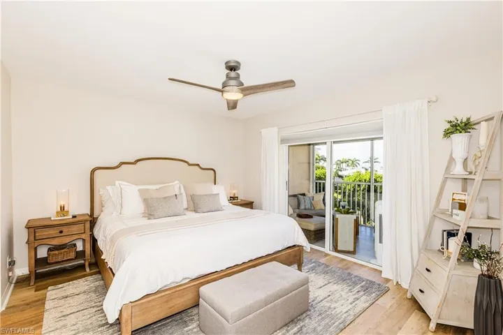 Bedroom featuring light wood-type flooring, ceiling fan, and access to exterior