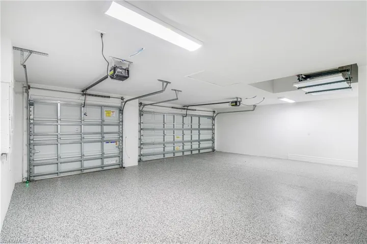 Garage featuring a garage door opener