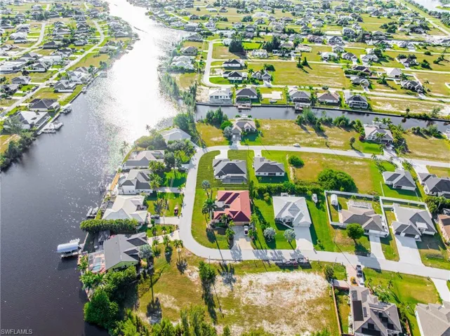 Aerial view of residential area with a large body of water