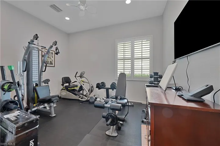 Workout room with ceiling fan, recessed lighting, and baseboards