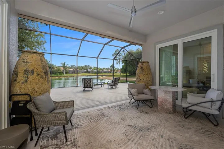 View of patio / terrace with a water view and a lanai