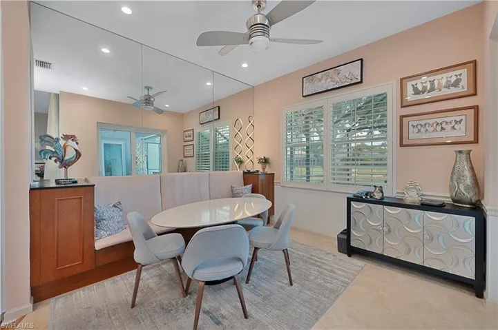 Dining room with ceiling fan and recessed lighting
