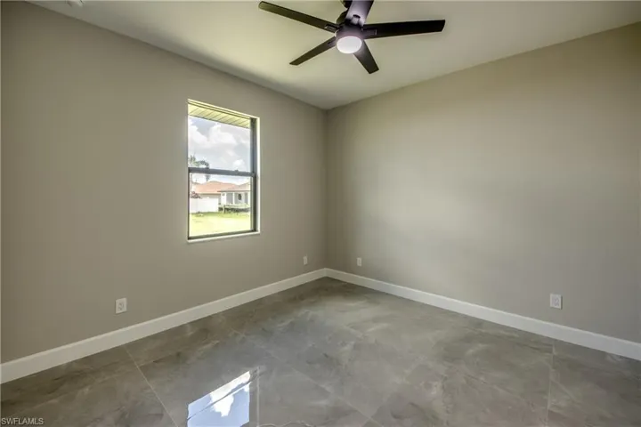 Tiled 3RD BEDROOM  with ceiling fan