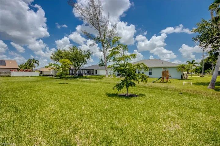 View of yard and well maintained neighborhood