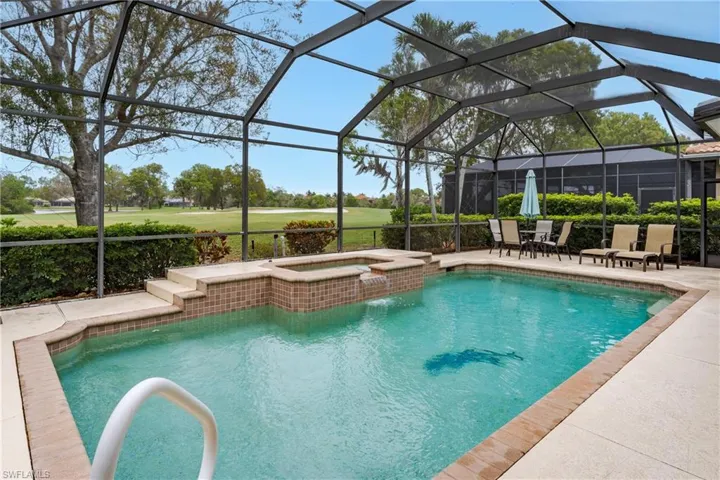Integrated pool / hot tub with a lanai, a patio area, view of golf course, and a sunroom