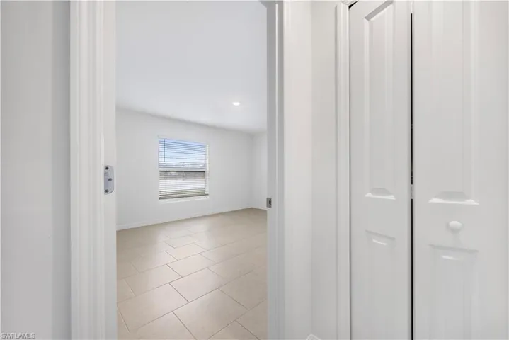 Unfurnished room featuring light tile patterned floors and recessed lighting