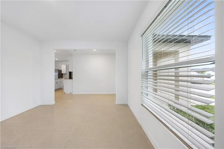 Unfurnished room featuring baseboards and recessed lighting
