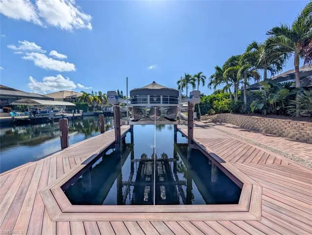 Dock with a water view and boat lift