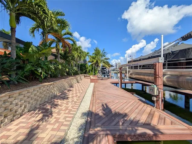 Dock with boat lift and a water view