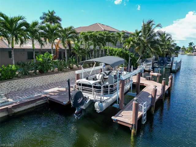 Dock featuring a water view and boat lift