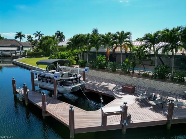 Dock area featuring a water view and boat lift