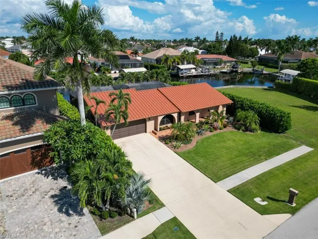 Aerial view of residential area with a large body of water