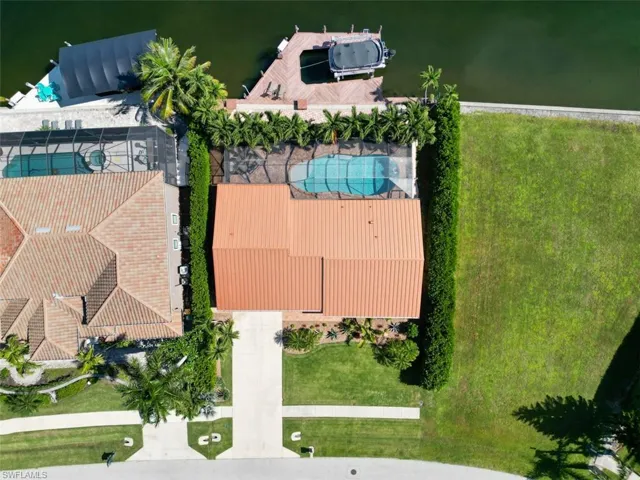 Bird's eye view of a pool and a large body of water