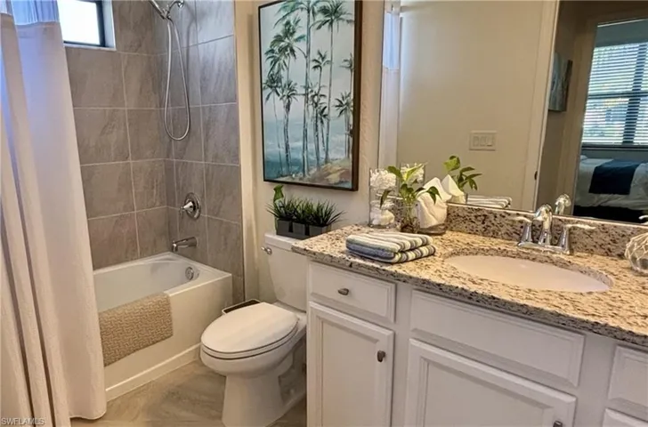 Ensuite bathroom with vanity and shower / bath combo