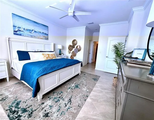 Bedroom featuring ornamental molding and ceiling fan