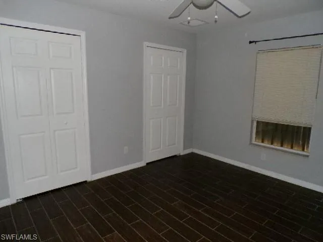 Unfurnished bedroom featuring a closet and ceiling fan