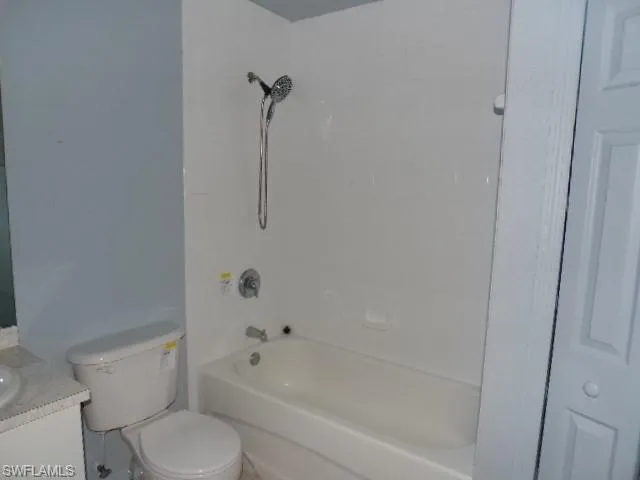 Full bath with vanity and shower / washtub combination