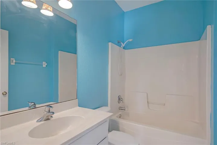Bathroom featuring shower / bath combination and vanity