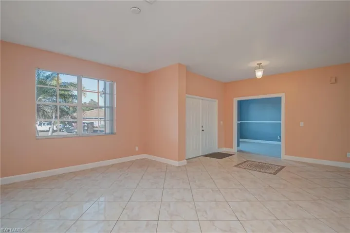 Unfurnished room with baseboards