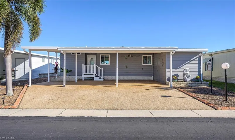 View of front facade with a carport