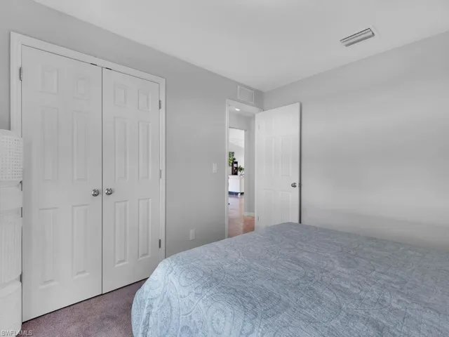 Bedroom with carpet floors and a closet