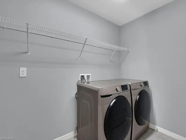 Laundry room featuring washing machine and dryer