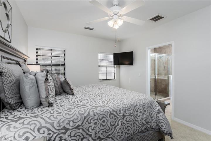 Spacious main bedroom with ceiling fan