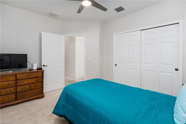Bedroom #3 with newer ceiling fan