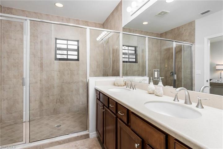 Extra large tiled walk-in shower in main bathroom
