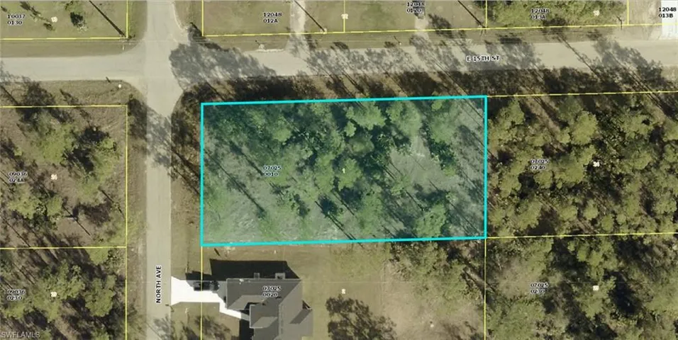 Aerial map of property and surrounding area featuring property parcel outlined