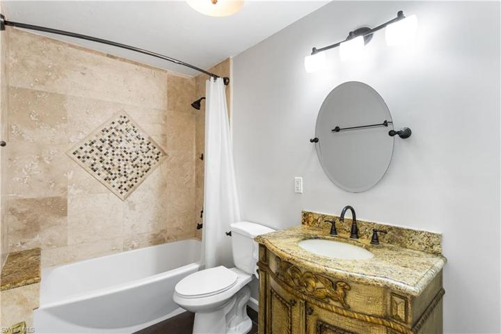 Bathroom with Shower/Tub combo shared with the secondary bedrooms.