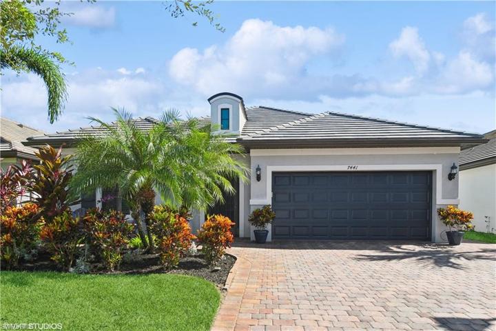 beautiful front landscaping with extended driveway