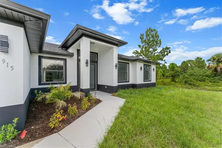 Doorway to property with stucco siding