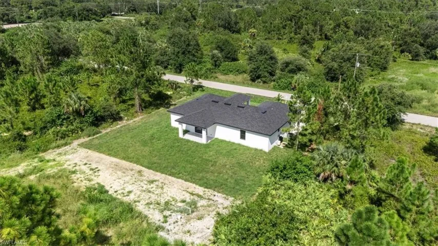 View from above of property with a heavily wooded area