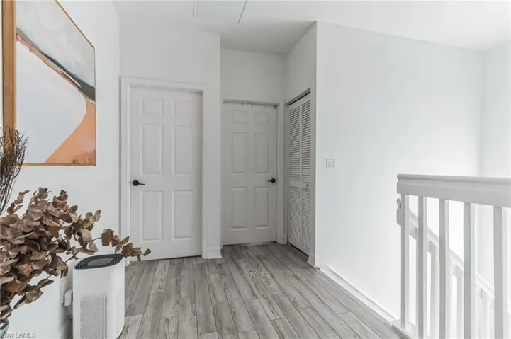 Corridor featuring light hardwood / wood-style floors