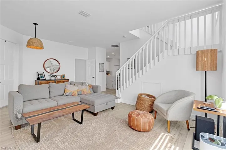 Living room with light hardwood / wood-style flooring