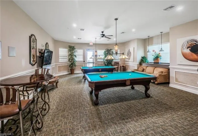 Recreation room featuring a ceiling fan, billiards, carpet flooring, recessed lighting, and wainscoting