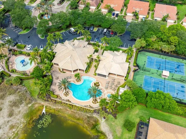 Aerial view of residential area featuring a pool area